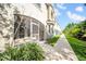 Exterior view showcasing screened in patio and beautiful landscaping at 5312 6Th N Way, St Petersburg, FL 33703
