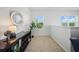Cozy loft area with a comfortable chair, console table, and natural light at 5312 6Th N Way, St Petersburg, FL 33703