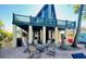 Spacious backyard with a fire pit, seating area, and a view of the elevated home at 5341 Circle Dr, Weeki Wachee, FL 34607