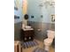 Cozy bathroom featuring a pedestal sink, metal accents, and unique decorative touches at 5341 Circle Dr, Weeki Wachee, FL 34607