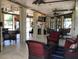 Inviting outdoor patio with comfortable seating, ceiling fans, and natural light at 5341 Circle Dr, Weeki Wachee, FL 34607