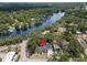 A beautiful single-Gathering home is near a tranquil river and lush greenery, providing serene waterfront living at 5415 Park Pl, Tampa, FL 33603