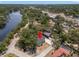 Aerial view of a home nestled near a river, surrounded by lush trees, and close to community amenities at 5415 Park Pl, Tampa, FL 33603