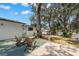 Charming backyard features mature trees and a wood deck, perfect for outdoor relaxation at 5415 Park Pl, Tampa, FL 33603