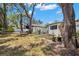 Spacious backyard with mature trees for shade and privacy, a great area for outdoor activities at 5415 Park Pl, Tampa, FL 33603
