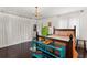 Comfortable bedroom with dark hardwood floors, chandelier, and white curtains at 5415 Park Pl, Tampa, FL 33603