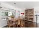 Dining Room featuring Hardwood floors, a decorative cabinet and a clear view into the Living Room at 5415 Park Pl, Tampa, FL 33603