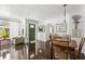 Warm and inviting foyer with original hardwood flooring, classic decor and green front door at 5415 Park Pl, Tampa, FL 33603