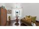 Inviting sitting area featuring an upholstered day bed, hardwood floors, and sheer white curtains at 5415 Park Pl, Tampa, FL 33603