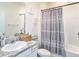 Bathroom with a single sink, granite countertops, and a shower-tub combination at 5464 Flint Hills Dr, Wimauma, FL 33598