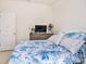 Bedroom featuring bright natural light, neutral paint, and tile flooring at 5464 Flint Hills Dr, Wimauma, FL 33598