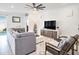 Spacious living room with cozy furniture and plenty of natural light at 5464 Flint Hills Dr, Wimauma, FL 33598