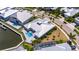 Wonderful aerial view of a home with a private pool and well-maintained lawn and close proximity to the waterfront at 5717 Tybee Island Dr, Apollo Beach, FL 33572