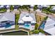 Gorgeous aerial view of a private pool and manicured yard with a backyard facing the water at 5717 Tybee Island Dr, Apollo Beach, FL 33572
