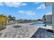 Backyard featuring a fenced-in pool and spa with stone pavers, offering privacy and relaxation at 5717 Tybee Island Dr, Apollo Beach, FL 33572