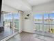 Balcony with waterfront view from the main bedroom, featuring sliding glass doors at 5820 Balao S Way, St Pete Beach, FL 33706