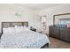Inviting bedroom with stylish dark wood furniture, soft lighting and a serene ambiance at 5820 Balao S Way, St Pete Beach, FL 33706