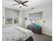 Bright bedroom features cozy textures, natural light and views of the neighborhood at 5820 Balao S Way, St Pete Beach, FL 33706