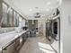 Modern kitchen featuring stainless steel appliances, sleek cabinetry, and ample counter space at 5820 Balao S Way, St Pete Beach, FL 33706