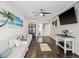 A roomy living room with tile flooring offers ample seating, entertainment options, and stylish decor at 5820 Balao S Way, St Pete Beach, FL 33706