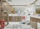 Bright main bathroom featuring a glass shower, dual sinks, and modern fixtures at 5820 Balao S Way, St Pete Beach, FL 33706