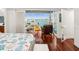 Main bedroom with a large window providing stunning water views and natural light to the room at 5820 Balao S Way, St Pete Beach, FL 33706