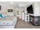 Spacious main bedroom features a fireplace, TV, and view into the main bath at 5820 Balao S Way, St Pete Beach, FL 33706