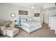 Bright main bedroom with water views, seating area, and modern decor at 5820 Balao S Way, St Pete Beach, FL 33706