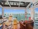 Bright office space with water views, a modern desk setup, and comfortable seating at 5820 Balao S Way, St Pete Beach, FL 33706
