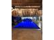 Luxurious pool with a tiki hut featuring an outdoor kitchen and spiral staircase at 5820 Balao S Way, St Pete Beach, FL 33706