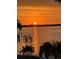 Gorgeous waterfront view with a colorful sunset over the skyline at 5820 Balao S Way, St Pete Beach, FL 33706
