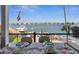 Breathtaking waterfront views from the dining table, overlooking the boat dock and serene water at 5820 Balao S Way, St Pete Beach, FL 33706