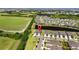 Expansive aerial view of a home in a community featuring lush green spaces and a tranquil lake at 6206 Mooring Line Cir, Apollo Beach, FL 33572