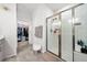 This bathroom has a glass-doored shower and entrance to a walk-in closet at 6206 Mooring Line Cir, Apollo Beach, FL 33572