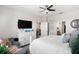 The primary bedroom has a ceiling fan and is decorated with wall art at 6206 Mooring Line Cir, Apollo Beach, FL 33572