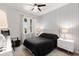 Serene bedroom featuring a patterned accent wall, a cozy bed, and soft, natural light at 6206 Mooring Line Cir, Apollo Beach, FL 33572