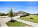 Well-maintained home exterior with a lush lawn and tidy landscaping at 6206 Mooring Line Cir, Apollo Beach, FL 33572