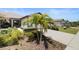 Beautifully landscaped front yard with lush greenery and a well-maintained lawn at 6206 Mooring Line Cir, Apollo Beach, FL 33572