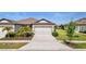 Charming single-Gathering home featuring a two-car garage and beautifully landscaped front yard at 6206 Mooring Line Cir, Apollo Beach, FL 33572
