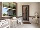 Inviting front porch featuring cozy seating and stylish décor at 6206 Mooring Line Cir, Apollo Beach, FL 33572