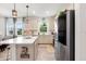 Bright kitchen featuring stainless steel appliances and a large island at 6206 Mooring Line Cir, Apollo Beach, FL 33572