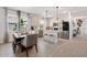Bright, open kitchen with stainless steel appliances, a large island, and a dining area at 6206 Mooring Line Cir, Apollo Beach, FL 33572
