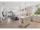 Open-concept kitchen and living area with stylish island and modern design at 6206 Mooring Line Cir, Apollo Beach, FL 33572