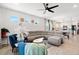 Bright living room with a comfortable seating area, ceiling fan, and an open layout at 6206 Mooring Line Cir, Apollo Beach, FL 33572