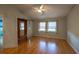 Bedroom with hardwood floors, a ceiling fan, and natural light from the windows at 6438 Brentwood Dr, Zephyrhills, FL 33542
