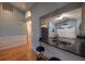 Kitchen featuring granite counters, stainless appliances, and a breakfast bar overlooking the living area at 6438 Brentwood Dr, Zephyrhills, FL 33542