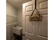 The laundry room boasts shelving and a utility sink for added convenience at 6438 Brentwood Dr, Zephyrhills, FL 33542