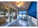 The sunroom with sliding doors and large windows provides indoor-outdoor living at 6438 Brentwood Dr, Zephyrhills, FL 33542