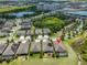 Aerial shot showing home, neighborhood and proximity to local lake, community and parks at 6440 Maiden Sea Dr, Apollo Beach, FL 33572