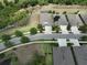 Aerial view of neighborhood, showing homes, streets, and nearby water features at 6440 Maiden Sea Dr, Apollo Beach, FL 33572